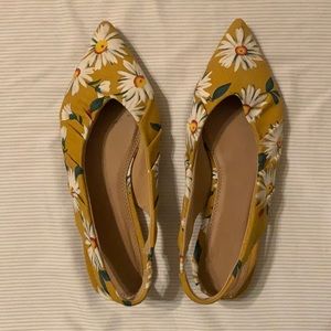 Yellow pointy flats with flowers